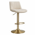 Tabouret en tissu beige avec piètement en métal doré